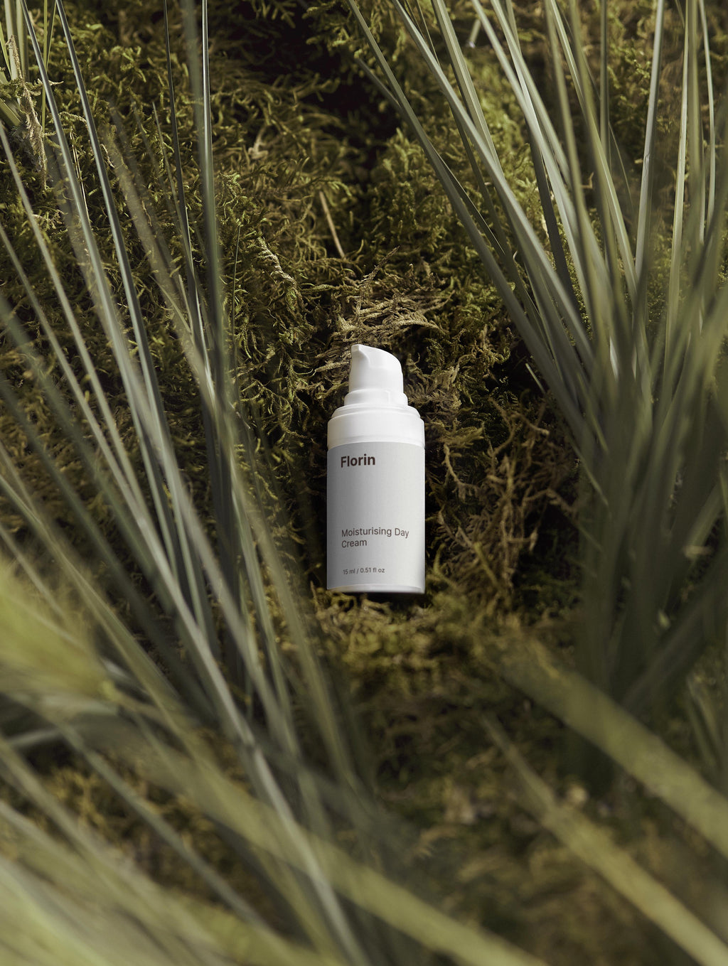 Florin skincare product bottle in a natural setting with plants