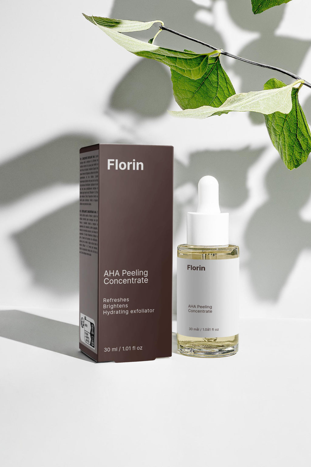 Florin AHA Peeling Concentrate bottle and box on a light background with leaves.
