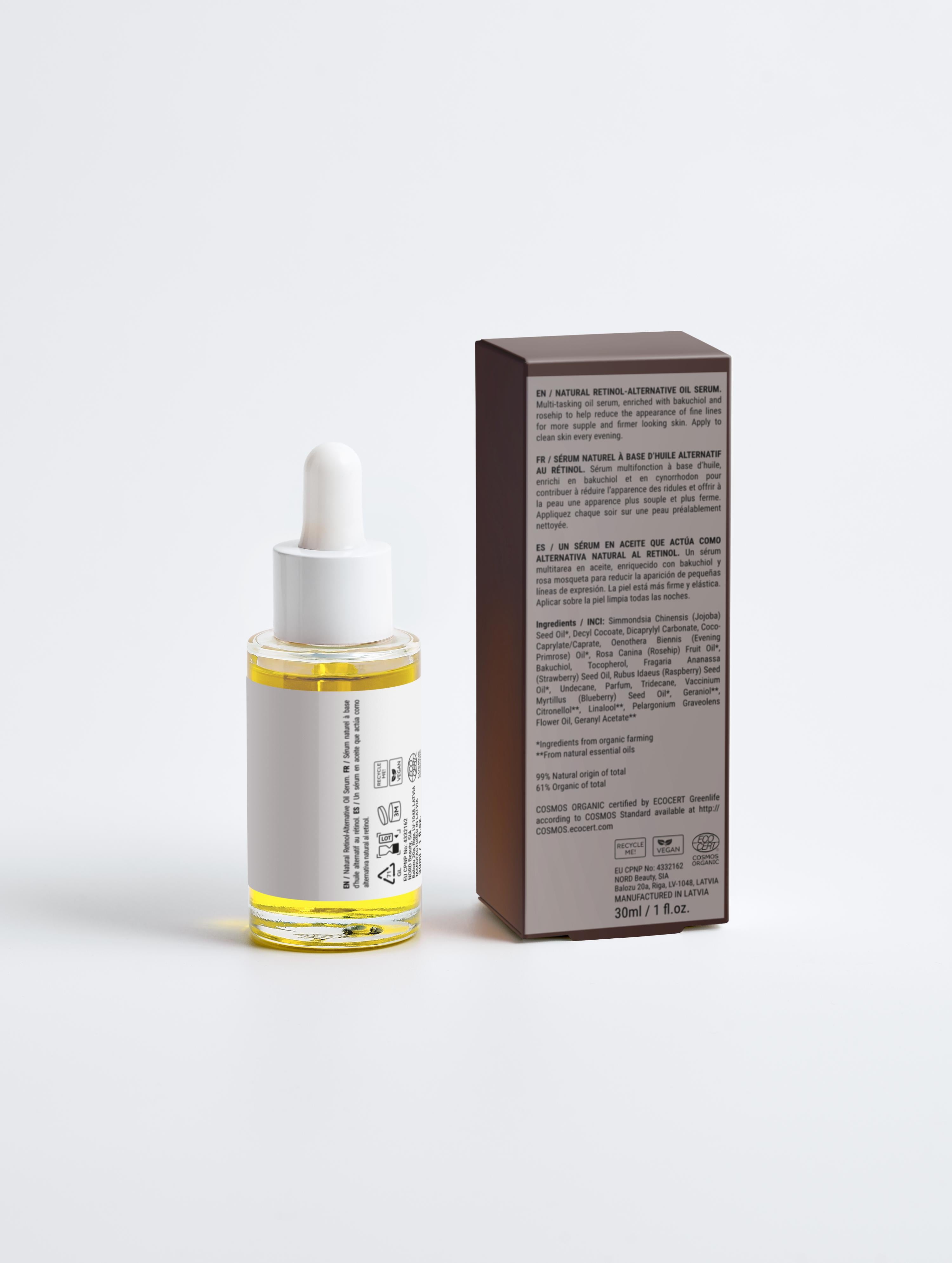 Skincare serum bottle with dropper and its packaging on a light gray background