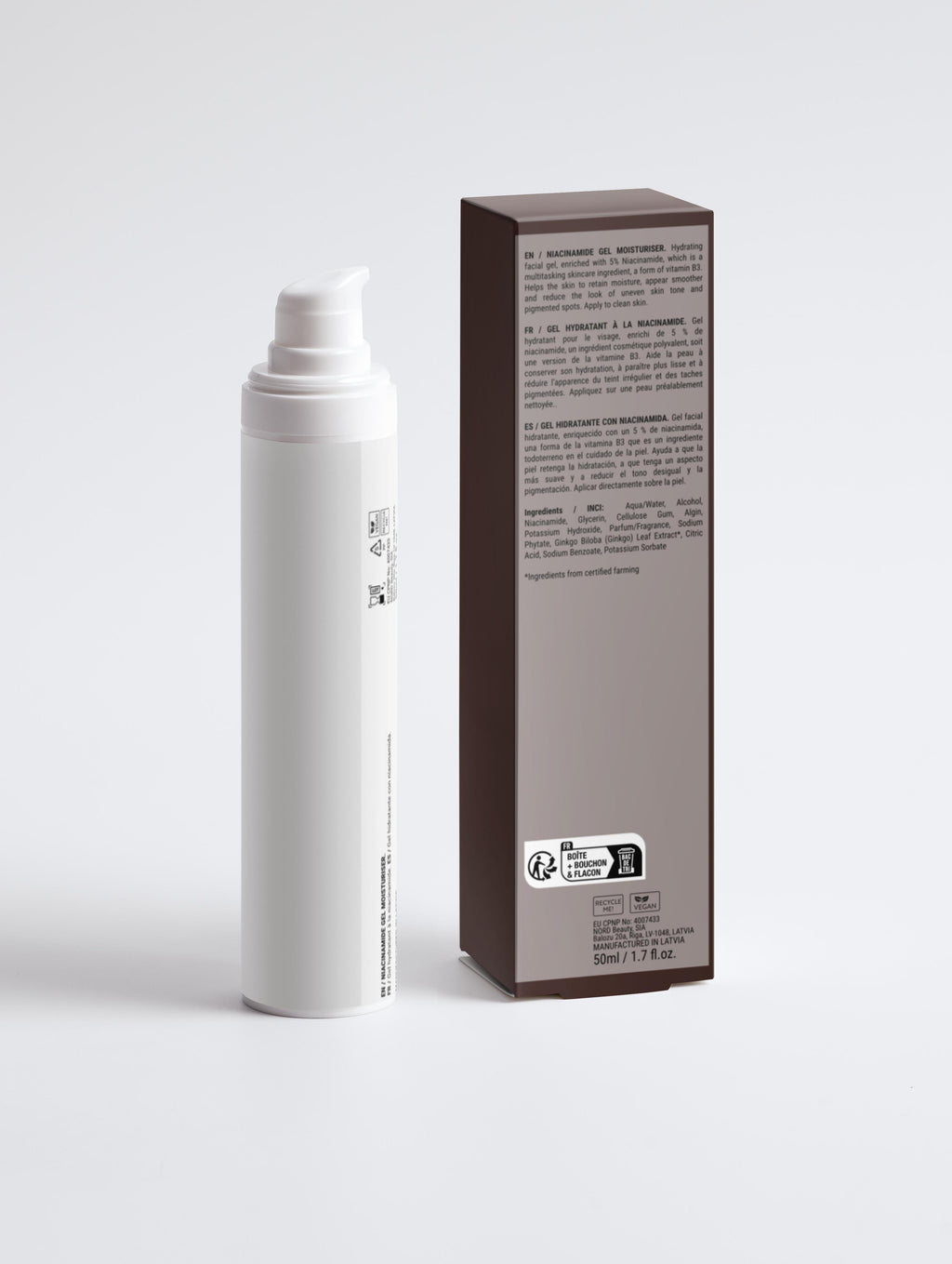 White spray bottle and its packaging on a light gray background
